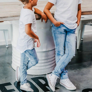 Distressed Jeg Jeans (Blue Denim)